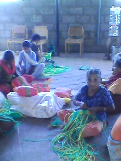 Clients weaving wire baskets